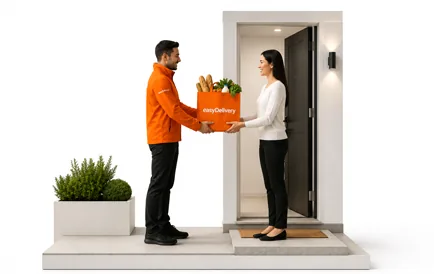 Courier handing groceries to a customer at their door